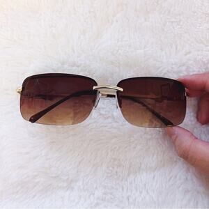 Delia Brown Rimless Butterfly Accent Sunglasses